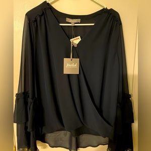 Beautiful navy blue blouse. New. High quality fabric. Semi-sheer arms.